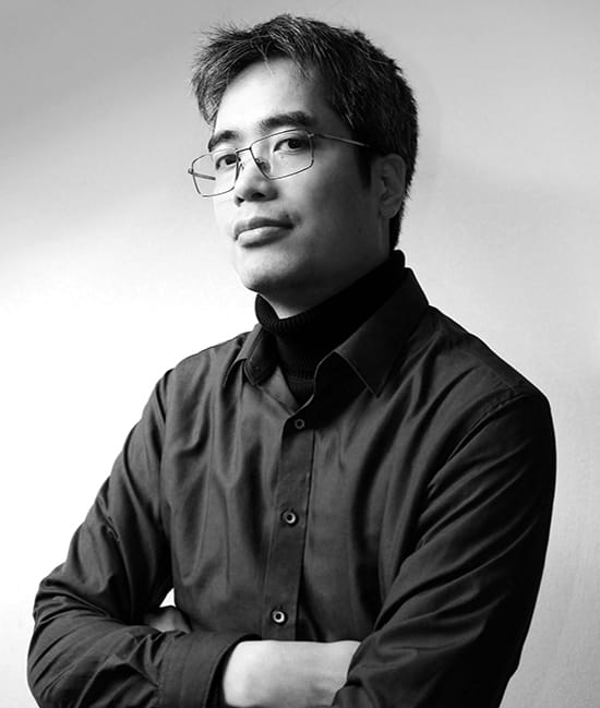 a man with glasses and a black shirt